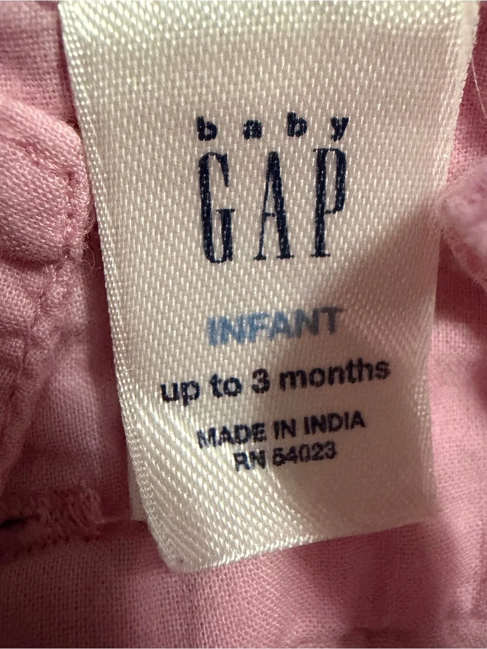 GAP Infant White Tag on Pink Garment